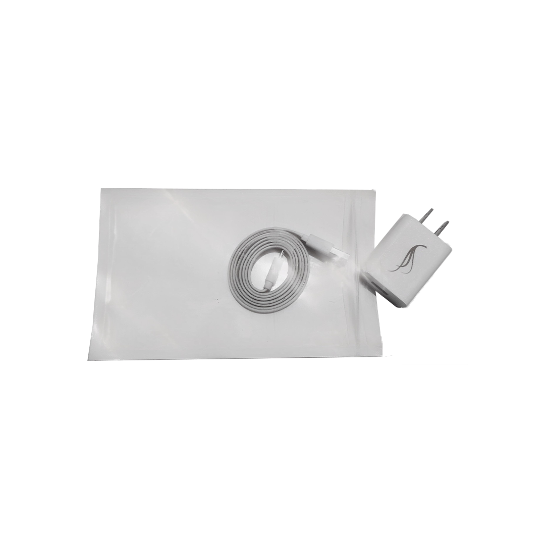 White charging cable and adapter on a white background